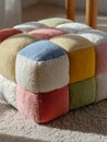 Colorful plush cube ottoman with patchwork design on soft carpet Royalty Free Stock Photo