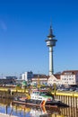 Colorful police ship in front of the radar tower of Bremerhaven Royalty Free Stock Photo