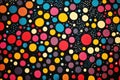 Colorful Polka Dot Pattern on a Dark Background Showcasing Various Sizes a Royalty Free Stock Photo