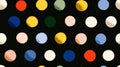 Colorful polka dots pattern on a black background with subtle shadows and highlights Royalty Free Stock Photo