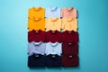 colorful polo shirts arranged in rows on a blue background