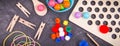 Colorful pompoms, balls and rubber erasers using for development of kids motor skills, coordination and logical thinking