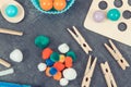 Colorful pompoms, balls and rubber erasers using for development of kids motor skills, coordination and logical thinking Royalty Free Stock Photo