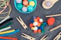 Colorful pompoms, balls and rubber erasers using for playing and development of kids motor skills, coordination and logical Royalty Free Stock Photo