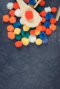 Colorful pompoms with spoon and tongs. Development of kids motor skills, coordination, creativity and logical thinking. Place for