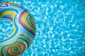 Colorful pool float in blue swimming basin Royalty Free Stock Photo