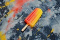 Colorful popsicle on an abstract painted background