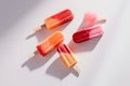 Colorful popsicle displayed against a plain white backdrop. Generative AI Royalty Free Stock Photo