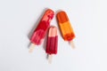 Colorful popsicle displayed against a plain white backdrop. Generative AI Royalty Free Stock Photo