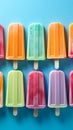 Colorful popsicles displayed on a blue background, top view