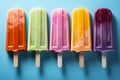 Colorful popsicles displayed on a blue background, top view