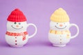 Colorful Porcelain Mug as Snowman on purple background,