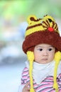 colorful portrait of cute baby boy dressed in lion custume,looking for something on blurry background.