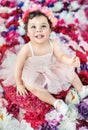 Colorful portrait of a tor lying on the flower carpet Royalty Free Stock Photo