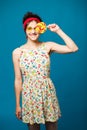 Colorful portrait young funny fashion girl posing on blue Royalty Free Stock Photo