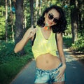 Colorful portrait of young funny fashion girl posing in summer style outfit Royalty Free Stock Photo