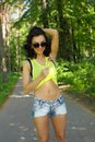 Colorful portrait of young funny fashion girl posing in summer style outfit