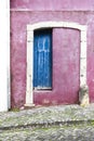 Colorful portuguese facade with blue wooden door Royalty Free Stock Photo
