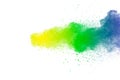 Colorful powder explosion on white background.Abstract blue yellow green  color dust particles splash Royalty Free Stock Photo