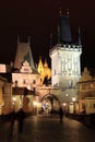 Colorful Prague St. Nicholas' Cathedral with Bridge Tower from Charles Bridge above the River Vltava in the Night Royalty Free Stock Photo