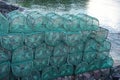 Colorful prawn traps piled on a dock in western Scotland