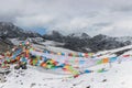 Colorful prayer flags on snow mountain Royalty Free Stock Photo