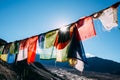 Colorful prayer flags with sun shining through one of prayer flags in Leh, Ladakh, India