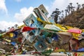 Colorful prayer flags tied around a wooden endless knot Buddhist symbol in Bumthang, Bhutan Royalty Free Stock Photo