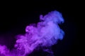 Colorful puff of smoke isolated on black Royalty Free Stock Photo