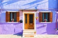 Colorful purple house in Burano island near Venice, Italy. Famus tourist place. Royalty Free Stock Photo