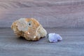 colorful purple stone and planetoid on a wooden background with copy space
