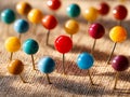 Colorful push pins arranged on a textured surface creating a vibrant pattern Royalty Free Stock Photo