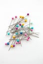 Colorful push pins for sewing on a white background Royalty Free Stock Photo