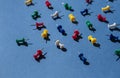 Colorful push pins or thumbtacks on the blue background. Royalty Free Stock Photo