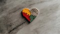 Colorful puzzle heart on marble surface Royalty Free Stock Photo