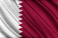 Colorful Qatar flag waving in the wind.