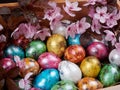 Colorful quail Easter eggs in a wooden box Royalty Free Stock Photo