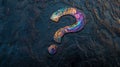 Colorful question mark on a textured dark background. Royalty Free Stock Photo