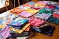 colorful quilt fabric squares laid out on a table