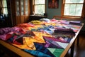 colorful quilt squares spread out on a table