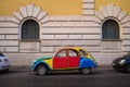 Rome, Italy: Colorful and quirky customized Volkswagen Beetle parked on the side of a cobblestone street. Royalty Free Stock Photo