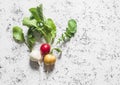 Colorful radishes on a light background, top view. Royalty Free Stock Photo