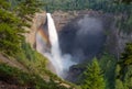 Colorful rainbow around the tumbling waters of Helmcken Falls, BC Royalty Free Stock Photo