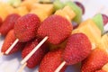 Colorful rainbow colors fruit kebab sticks close up Royalty Free Stock Photo