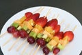 Colorful rainbow colors fruit kebab sticks Royalty Free Stock Photo