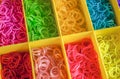 A Colorful Rainbow loom rubber bands in a box Royalty Free Stock Photo