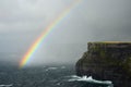 A colorful rainbow over the Cliffs of Moher in Ireland