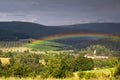 Colorful rainbow over mountains