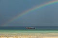 Colorful rainbow over a Tropical beach of Andaman Sea, Thailand.