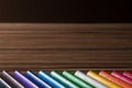 Colorful rainbow pencils on the brown table background Royalty Free Stock Photo